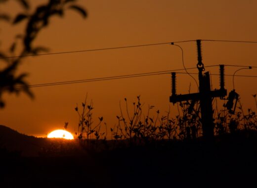 The sun sets behind Mt Tamalpais with a silhouette of a power line.