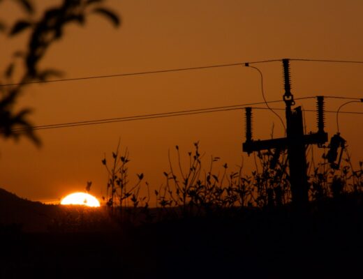 The sun sets behind Mt Tamalpais with a silhouette of a power line.